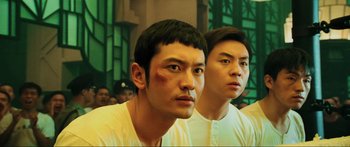 Movie still from “Ip Man 2” (2010), directed by Wilson Yip – Two asian men in white shirts with red marks on their faces; Close Up shot, Low angle