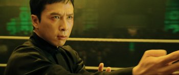 Movie still from “Ip Man 2” (2010), directed by Wilson Yip – A person sitting in a car; Close Up shot, Low angle