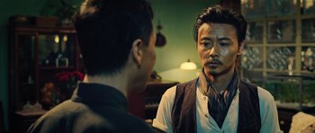 Movie still from “Ip Man 3” (2015), directed by Wilson Yip – Two men are talking in front of a mirror; Close Up shot, Over the shoulder angle