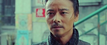 Movie still from “Ip Man 3” (2015), directed by Wilson Yip – A person wearing a jacket; Close Up shot, Low angle