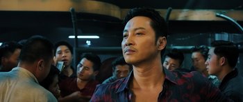 Movie still from “Ip Man 3” (2015), directed by Wilson Yip – A group of men sitting in a bus with one man looking up; Close Up shot, Low angle