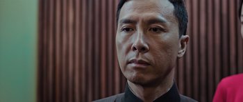Movie still from “Ip Man 3” (2015), directed by Wilson Yip – A person wearing a suit; Close Up shot, Low angle