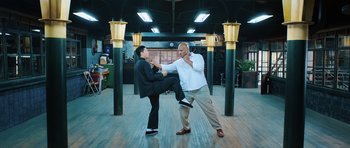 Movie still from “Ip Man 3” (2015), directed by Wilson Yip – Two men are fighting in a room; Wide shot, Low angle