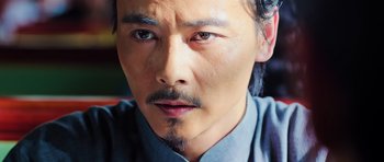 Movie still from “Ip Man 3” (2015), directed by Wilson Yip – A person with a mustache; Close Up shot, Low angle
