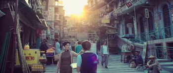 Movie still from “Ip Man 3” (2015), directed by Wilson Yip – A group of people walking down a street; Wide shot, Over the shoulder angle