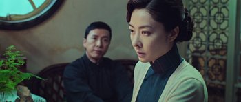 Movie still from “Ip Man 3” (2015), directed by Wilson Yip – A man and a woman sitting next to each other; Medium shot, Over the shoulder angle
