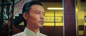 Movie still from “Ip Man 3” (2015), directed by Wilson Yip – A wax figure of an asian man in a white shirt; Close Up shot, Low angle