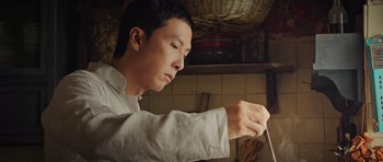Movie still from “Ip Man 3” (2015), directed by Wilson Yip – A man holding a knife in a kitchen; Close Up shot, Low angle