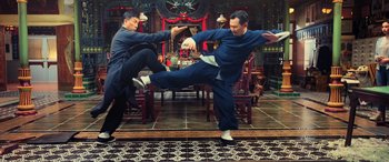 Movie still from “Ip Man 4: The Finale” (2019), directed by Wilson Yip – Two men are practicing martial arts in an oriental setting; Wide shot, Low angle