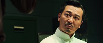 Movie still from “Ip Man 4: The Finale” (2019), directed by Wilson Yip – A person wearing a white shirt; Close Up shot, Low angle