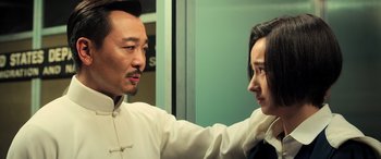Movie still from “Ip Man 4: The Finale” (2019), directed by Wilson Yip – A man and a woman are looking at one another; Close Up shot, Over the shoulder angle