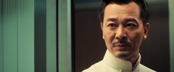 Movie still from “Ip Man 4: The Finale” (2019), directed by Wilson Yip – A person wearing a white shirt; Close Up shot, Low angle