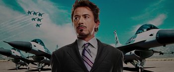 Movie still from “Iron Man” (2008), directed by Jon Favreau – A man in a suit and a tie; Close Up shot, Low angle