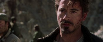 Movie still from “Iron Man” (2008), directed by Jon Favreau – A person with a beard; Close Up shot, Over the shoulder angle