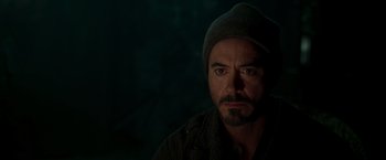 Movie still from “Iron Man” (2008), directed by Jon Favreau – A person wearing a hat; Close Up shot, Over the shoulder angle