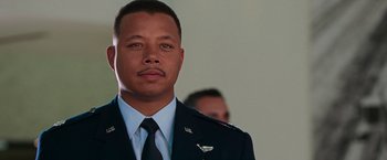 Movie still from “Iron Man” (2008), directed by Jon Favreau – A man in a military uniform standing next to another man; Close Up shot, Low angle