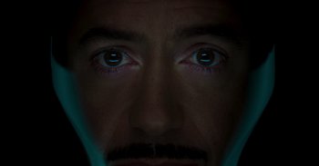 Movie still from “Iron Man” (2008), directed by Jon Favreau – A man's eyes with a light shining on them; Extreme Close Up shot, Overhead angle