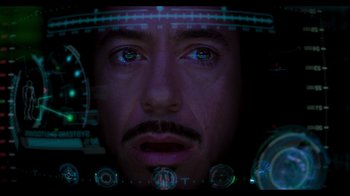 Movie still from “Iron Man” (2008), directed by Jon Favreau – The face of a man in a space helmet; Extreme Close Up shot, Overhead angle