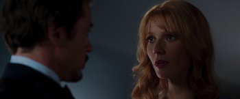 Movie still from “Iron Man” (2008), directed by Jon Favreau – A man and a woman talking to each other; Close Up shot, Over the shoulder angle