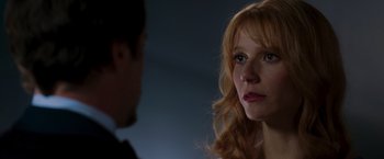 Movie still from “Iron Man” (2008), directed by Jon Favreau – A man and a woman looking at one another; Close Up shot, Over the shoulder angle