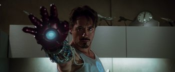 Movie still from “Iron Man” (2008), directed by Jon Favreau – A person holding a iron man arm; Close Up shot, Low angle
