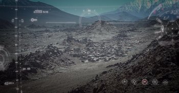 Movie still from “Iron Man” (2008), directed by Jon Favreau – A view of a mountain range from a distance; Extreme Wide shot, High angle