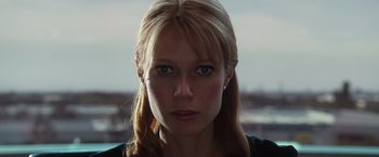 Movie still from “Iron Man” (2008), directed by Jon Favreau – A person with long blonde hair; Close Up shot, Low angle