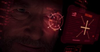 Movie still from “Iron Man” (2008), directed by Jon Favreau – A man's face with a red light coming out of his eye; Extreme Close Up shot, Overhead angle