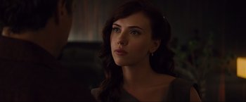 Movie still from “Iron Man 2” (2010), directed by Jon Favreau – A beautiful woman with long dark brown hair and blue eyes; Close Up shot, Over the shoulder angle