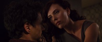 Movie still from “Iron Man 2” (2010), directed by Jon Favreau – A man and a woman looking at one another; Close Up shot, Over the shoulder angle