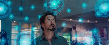 Movie still from “Iron Man 2” (2010), directed by Jon Favreau – A person looking up at the sky; Close Up shot, Low angle