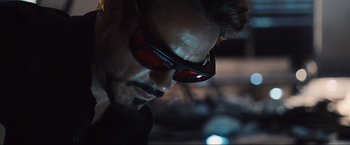 Movie still from “Iron Man 2” (2010), directed by Jon Favreau – A person wearing sunglasses; Close Up shot, Over the shoulder angle