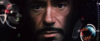 Movie still from “Iron Man 2” (2010), directed by Jon Favreau – The face of a man with a mustache; Extreme Close Up shot, Overhead angle