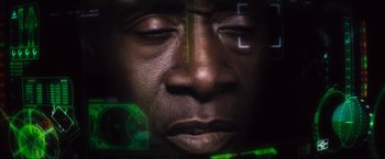 Movie still from “Iron Man 2” (2010), directed by Jon Favreau – A man's face with green lights in the background; Extreme Close Up shot, High angle