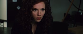 Movie still from “Iron Man 2” (2010), directed by Jon Favreau – A person with curly hair; Close Up shot, Over the shoulder angle
