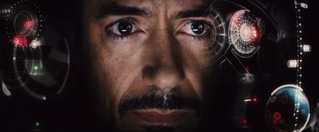 Movie still from “Iron Man 2” (2010), directed by Jon Favreau – A man's eyes with a spider web in the middle of his face; Extreme Close Up shot, Overhead angle