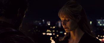 Movie still from “Iron Man 2” (2010), directed by Jon Favreau – A woman with her eyes closed in the dark; Close Up shot, Low angle