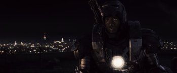 Movie still from “Iron Man 2” (2010), directed by Jon Favreau – A man with a flashlight in his hand; Medium shot, Over the shoulder angle