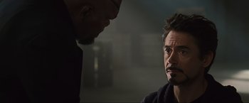 Movie still from “Iron Man 2” (2010), directed by Jon Favreau – Two men are looking at each other in a room; Close Up shot, Over the shoulder angle