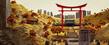 Movie still from “Isle of Dogs” (2018), directed by Wes Anderson – A model of an asian city with a red torii gate; Extreme Wide shot, High angle
