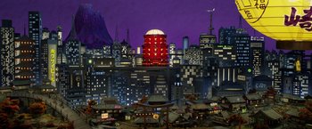Movie still from “Isle of Dogs” (2018), directed by Wes Anderson – An animated city with buildings and a red tower; Extreme Wide shot, High angle