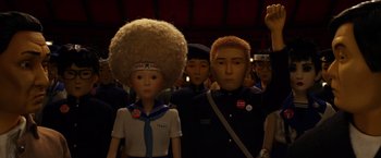 Movie still from “Isle of Dogs” (2018), directed by Wes Anderson – A group of people standing next to each other; Medium shot, Low angle