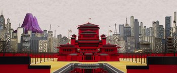 Movie still from “Isle of Dogs” (2018), directed by Wes Anderson – A large red building with a reflection of the sky in it's window; Extreme Wide shot, Overhead angle