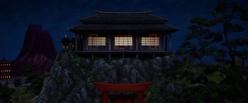 Movie still from “Isle of Dogs” (2018), directed by Wes Anderson – An asian style building sitting on top of a hill; Extreme Wide shot, High angle