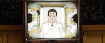 Movie still from “Isle of Dogs” (2018), directed by Wes Anderson – An old television screen with a cartoon of a man in a hospital bed; Extreme Close Up shot, Overhead angle