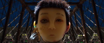 Movie still from “Isle of Dogs” (2018), directed by Wes Anderson – The face of a doll; Extreme Close Up shot, Low angle