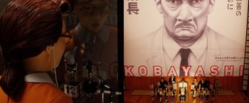Movie still from “Isle of Dogs” (2018), directed by Wes Anderson – A man standing in front of microphones in front of a poster; Medium shot, Low angle