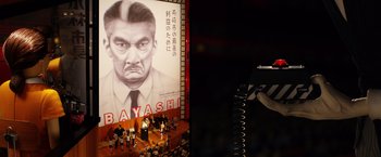 Movie still from “Isle of Dogs” (2018), directed by Wes Anderson – An image of a man with a mustache on a stage; Extreme Close Up shot, Low angle