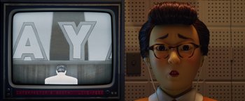 Movie still from “Isle of Dogs” (2018), directed by Wes Anderson – A doll head and a television screen; Close Up shot, Over the shoulder angle