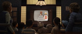 Movie still from “Isle of Dogs” (2018), directed by Wes Anderson – A group of people watching a cartoon on a television; Wide shot, Over the shoulder angle